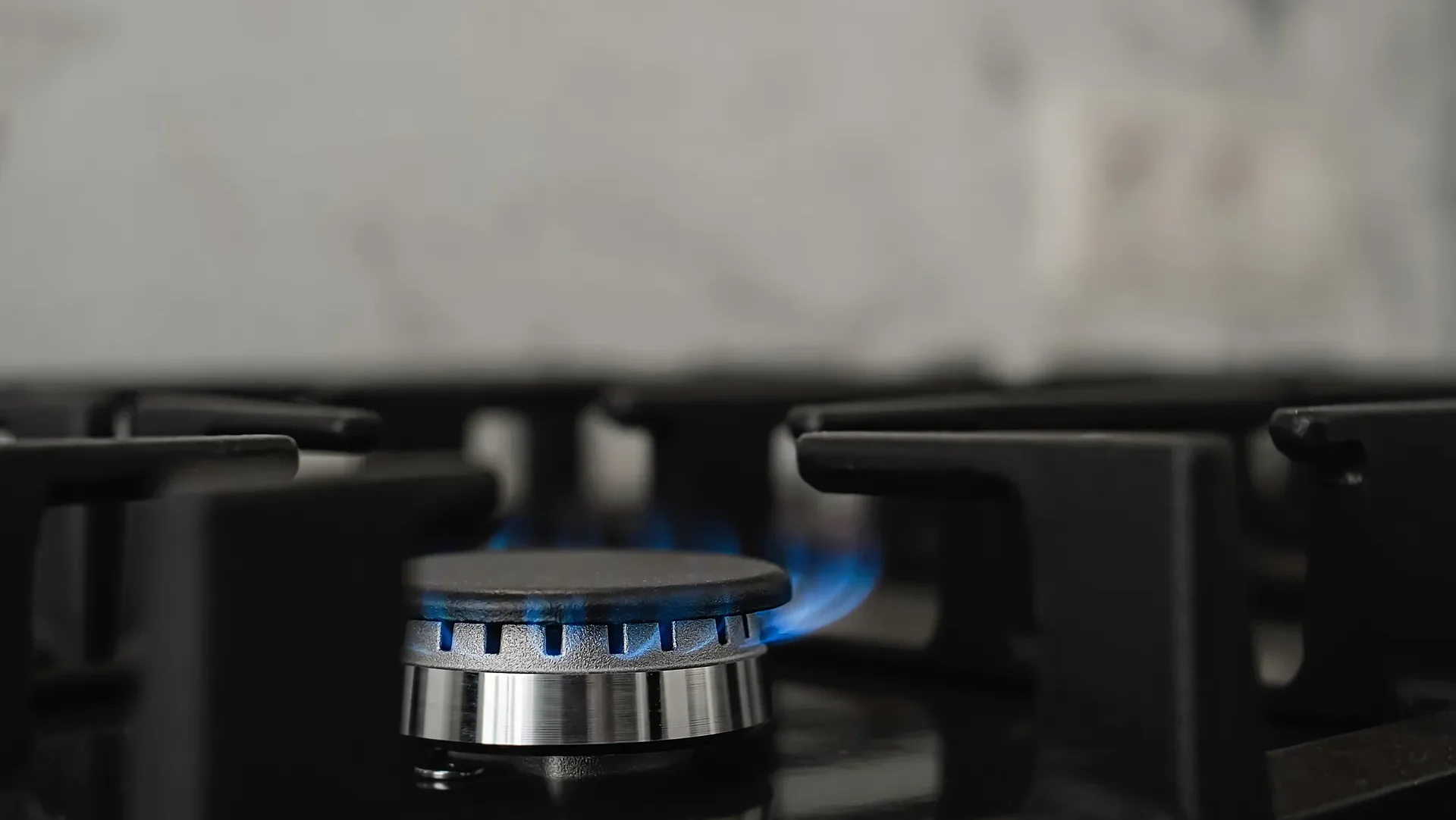 Modern Kitchen Stove Natural Gas Burns With Blue Flame Household Gas Consumption Close Up Selective Focus